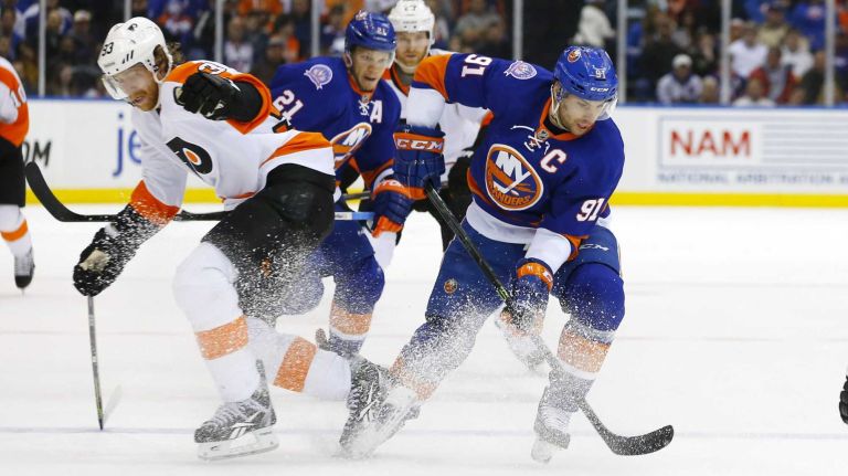 Islanders vs. Flyers 14 John Tavares #91 of the New York Islanders controls the puck against Jakub Voracek of the Philadelphia Flyers at Nassau Coliseum on Monday, Jan. 19, 2015.