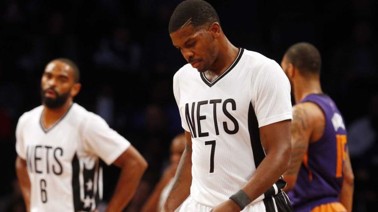 Joe Johnson 37 Joe Johnson, right, and Alan Anderson of the Brooklyn Nets walk to the bench during a timeout in an NBA game at Barclays Center on Friday, March 6, 2015.