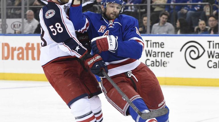 Rick Nash 37 Columbus Blue Jackets defenseman David Savard hits New York Rangers left wing Rick Nash in the third period of an NHL hockey game at Madison Square Garden on Sunday, February 22, 2015. The Rangers won 4-3 in a shootout.