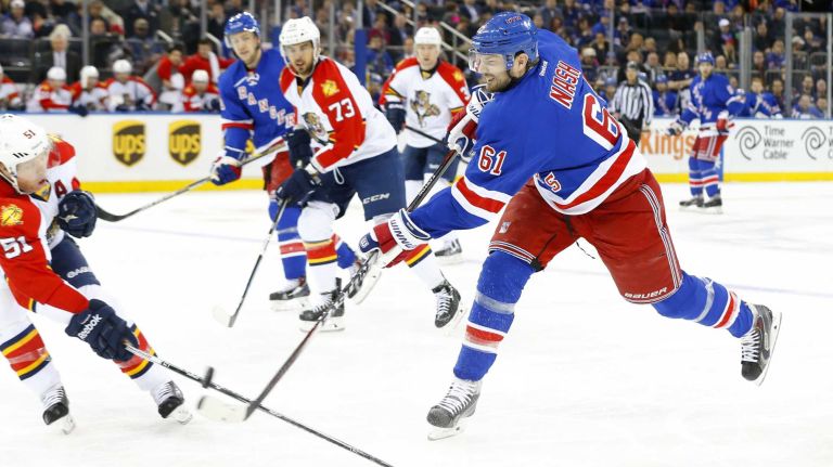 Rick Nash 48 Rick Nash #61 of the New York Rangers shoots the puck in the first period against Brian Campbell #51 of the Florida Panthers at Madison Square Garden on Sunday, Mar. 15, 2015 in New York City.