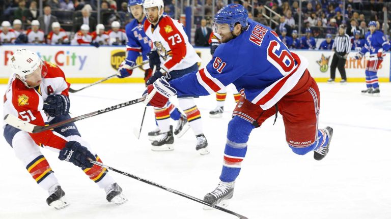 Rick Nash 49 Rick Nash #61 of the New York Rangers shoots the puck in the first period against Brian Campbell #51 of the Florida Panthers at Madison Square Garden on Sunday, Mar. 15, 2015 in New York City.