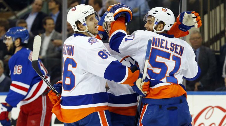 Frans Nielsen of the New York Islanders celebrates his second-period shorthanded goal against the New York Rangers with teammate Nikolay Kulemin at Madison Square Garden on Tuesday, Jan. 13, 2015.