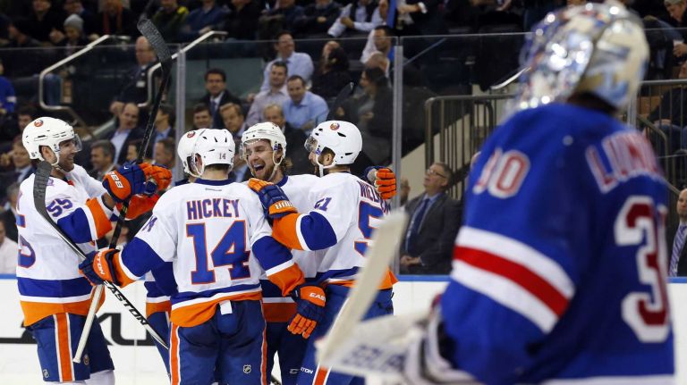 Frans Nielsen #51 of the New York Islanders celebrates his second-period shorthanded goal against Henrik Lundqvist #30 of the New York Rangers with his teammates at Madison Square Garden on Tuesday, Jan. 13, 2015.