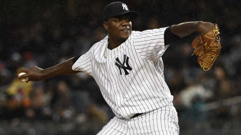 New York Yankees starting pitcher Michael Pineda delivers in the first inning against the Toronto Blue Jays in an MLB baseball game on Yankee Stadium on Wednesday, April 8, 2015.