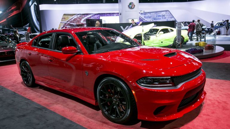 The 2015 Dodge Charger SRT Hellcat has the same mean supercharged HEMI V-8 Hellcat engine as the Challenger, which means 707 hp. Prices start at $63,995.