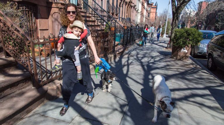 Janessa Kram, son Kai and dogs Lola, left, and Lex right in the Clinton Hill neighborhood of Brooklyn on April 6, 2015. Neighborhood Feature on Clinton HIll.