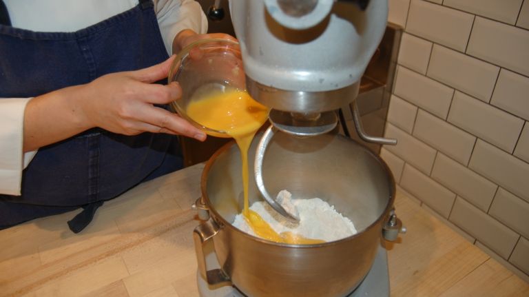 Add all of the remaining dough ingredients, except the butter, and mix on low speed for 4 minutes. Continue to mix on low speed for 30 minutes. 