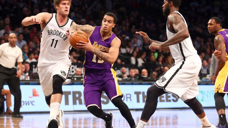 Los Angeles Lakers shooting guard Jabari Brown drives against Brooklyn Nets center Brook Lopez and Brooklyn Nets small forward Earl Clark during the third quarter at Barclays Center on Sunday, March 29, 2015.