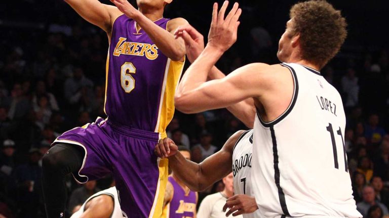 Los Angeles Lakers point guard Jordan Clarkson drives against Brooklyn Nets center Brook Lopez during the fourth quarter at Barclays Center on Sunday, March 29, 2015.