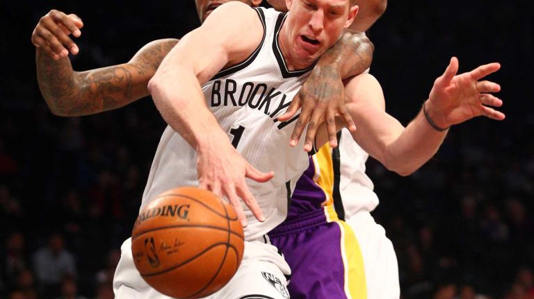 Brooklyn Nets center Mason Plumlee #1 and Brooklyn Nets center Brook Lopez #11 chase a rebound with Los Angeles Lakers power forward Tarik Black #28 during the first quarter of a game at Barclays Center on Sunday, March 29, 2015.