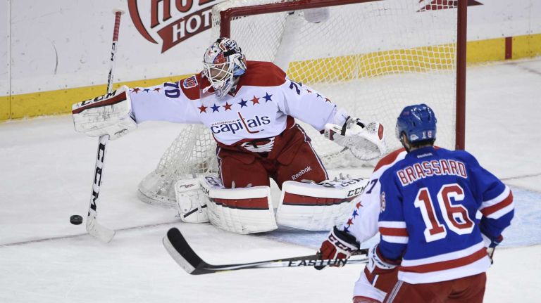 Rangers vs. Capitals 36 Washington Capitals goalie Braden Holtby deflects the puck against the New York Rangers in the second period of an NHL hockey game at Madison Square Garden on Sunday, March 29, 2015.