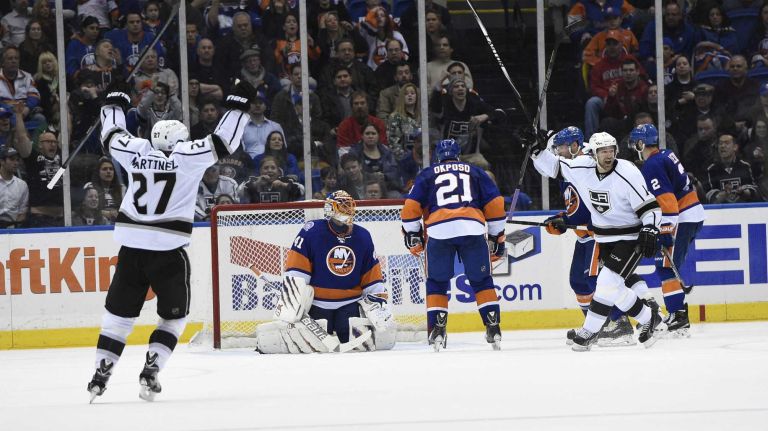 New York Islanders goalie Jaroslav Halak reacts as the Los Angeles Kings celebrate a goal by center Anze Kopitar in the third period of an NHL hockey game at Nassau Coliseum on Thursday, March 26, 2015. The Kings defeated the Islanders 3-2.