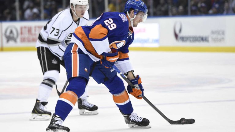 New York Islanders center Brock Nelson controls the puck against the Los Angeles Kings in the first period of an NHL hockey game at Nassau Coliseum on Thursday, March 26, 2015.