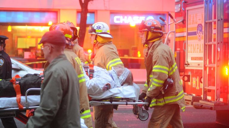 East Village building explosion: Photos 12 Emergency personnel move an injured New York City firefighter from the scene of the building fire on Second Avenue in Manhattan's East Village on Thursday, March 26, 2015.