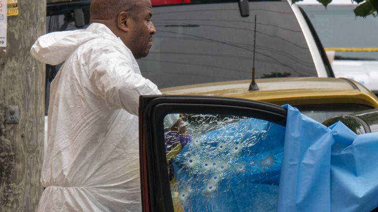 Two people sitting in a parked SUV were fatally shot in East New York on Friday morning, June 23, 2017, police said.