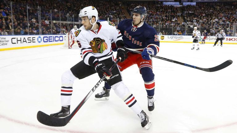 Chris Kreider of the New York Rangers skates against David Rundblad of the Chicago Blackhawks in the first period at Madison Square Garden on Wednesday, March 18, 2015.