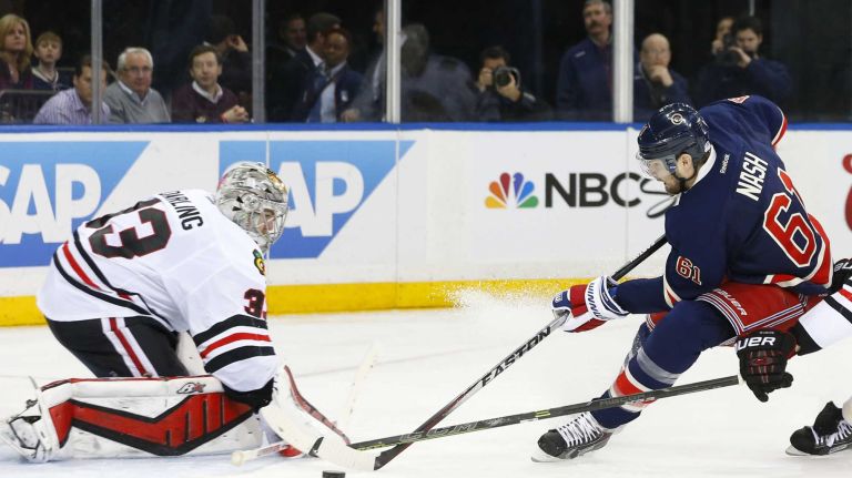 Rick Nash of the New York Rangers misses a third-period scoring chance against Scott Darling of the Chicago Blackhawks at Madison Square Garden on Wednesday, March 18, 2015.