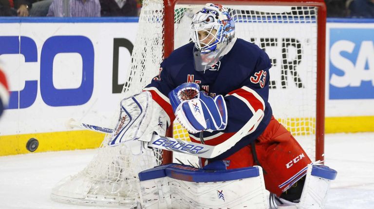 Cam Talbot of the New York Rangers makes a save in the second period against the Chicago Blackhawks at Madison Square Garden on Wednesday, March 18, 2015.