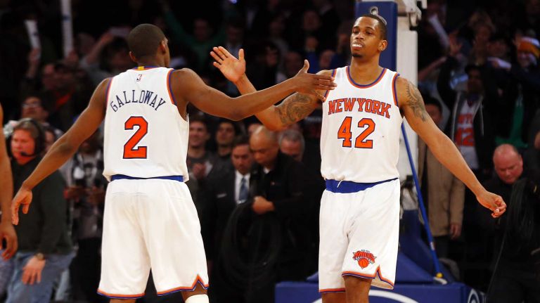 Langston Galloway and Lance Thomas of the New York Knicks celebrate after defeating the San Antonio Spurs at Madison Square Garden on Tuesday, March 17, 2015.