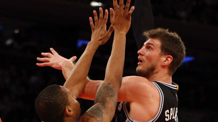 Tiago Splitter of the San Antonio Spurs takes a shot in the first half against Lance Thomas of the New York Knicks at Madison Square Garden on Tuesday, March 17, 2015.