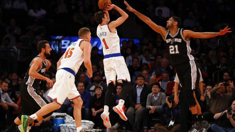 Alexey Shved of the New York Knicks takes a shot in the first half against Tim Duncan of the San Antonio Spurs at Madison Square Garden on Tuesday, March 17, 2015.