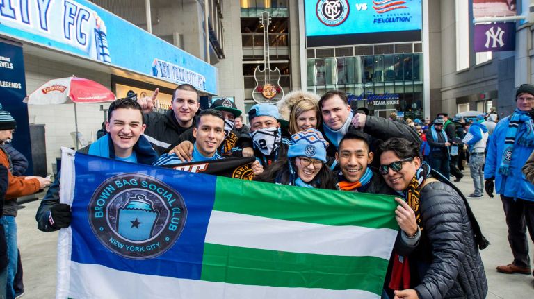 Fans pose for a photo before a game between the New York City FC and the New England Revolution at Yankee Stadium on Sunday, March 15, 2015.