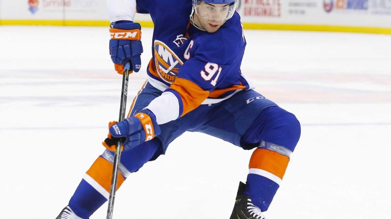 John Tavares of the New York Islanders controls the puck against the Montreal Canadiens at Nassau Coliseum on Saturday, March 14, 2015 in Uniondale.