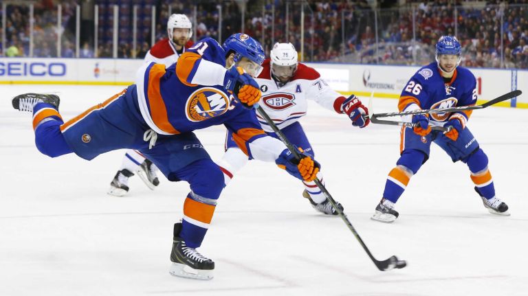 John Tavares of the New York Islanders shoots the puck against the Montreal Canadiens at Nassau Coliseum on Saturday, March 14, 2015 in Uniondale.