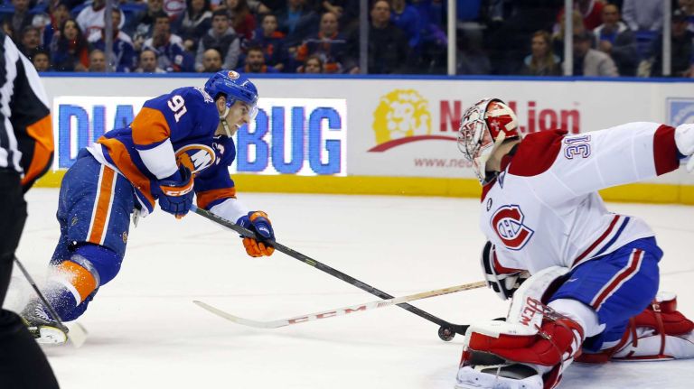 John Tavares of the New York Islanders is stopped late in the first period at Nassau Coliseum on Saturday, March 14, 2015.