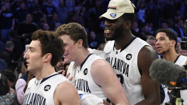 Villanova Wildcats including Daniel Ochefu, right, celebrate after winning the Big East basketball championship against the Xavier Musketeers at Madison Square Garden on Saturday, March 14, 2015.