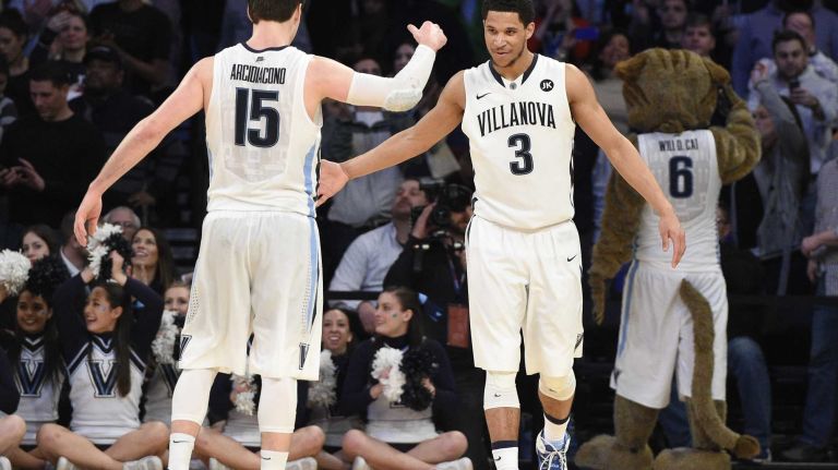 Villanova Wildcats guard Ryan Arcidiacono and guard Josh Hart celebrate as time runs out against the Xavier Musketeers for the Big East basketball championship at Madison Square Garden on Saturday, March 14, 2015. Villanova defeated Xavier 69-52.