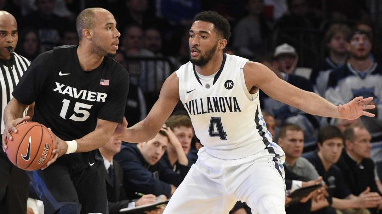 Villanova Wildcats guard Darrun Hilliard II defends Xavier Musketeers guard Myles Davis during the final game of the Big East basketball tournament at Madison Square Garden on Saturday, March 14, 2015.