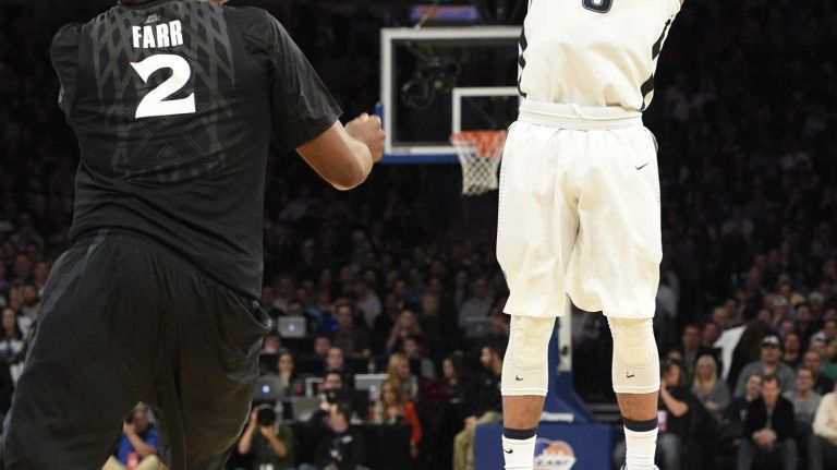 Villanova Wildcats guard Josh Hart sinks a three-point jump shot against the Xavier Musketeers during the final game of the Big East basketball tournament at Madison Square Garden on Saturday, March 14, 2015.