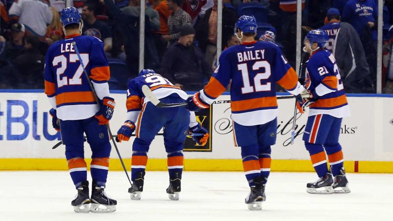Anders Lee, left, John Tavares, Josh Bailey and Kyle Okposo of the New York Islanders skate off the ice after a loss against the Ottawa Senators at Nassau Coliseum on Friday, March 13, 2015.
