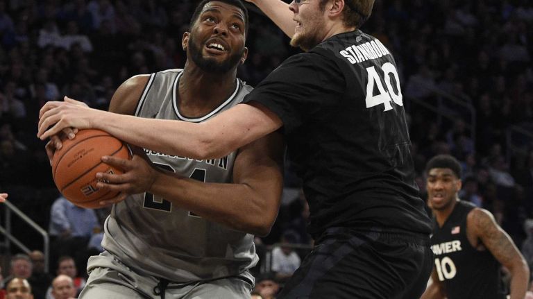 Big East Tournament semifinal: Georgetown vs. Xavier 48 Georgetown Hoyas center Joshua Smith is defended by Xavier Musketeers center Matt Stainbrook in a Big East semifinal men's basketball game at Madison Square Garden on Friday, March 13, 2015.