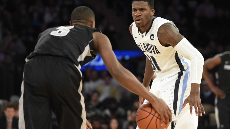 Villanova Wildcats guard Dylan Ennis defends against Providence Friars guard Kris Dunn in a Big East semifinal men's basketball game at Madison Square Garden on Friday, March 13, 2015.