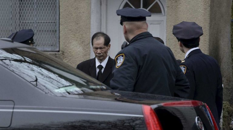 Wei Tang Liu, the father of slain NYPD Det. Wenjian Liu, leaves his son's home in Brooklyn headed to a funeral on Jan. 4, 2015, at the Ralph Aievoli & Sons funeral home in Dyker Heights.