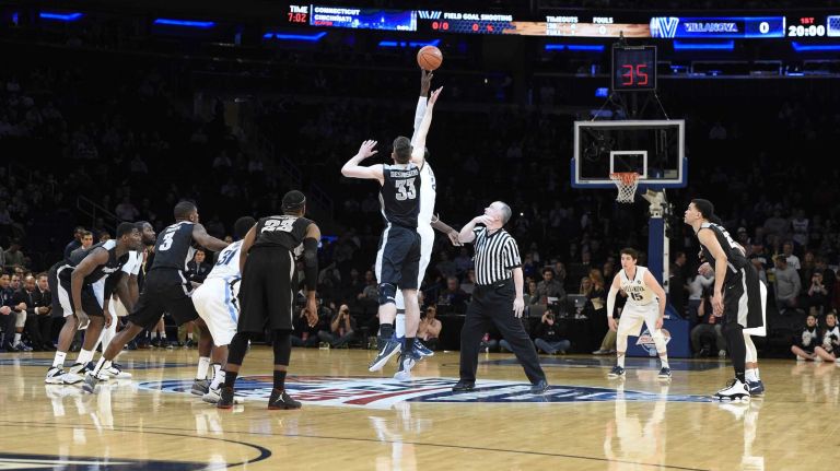 Villanova Wildcats forward Daniel Ochefu takes the opening tipoff with Providence Friars forward Carson Desrosiers in a Big East semifinal men's basketball game at Madison Square Garden on Friday, March 13, 2015.