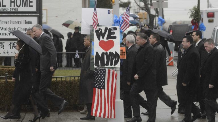 Mayor Bill de Blasio walks to the wake of Det. Wenjian Liu at Aievoli Funeral Home in Brooklyn on Saturday, Jan. 3, 2015. 