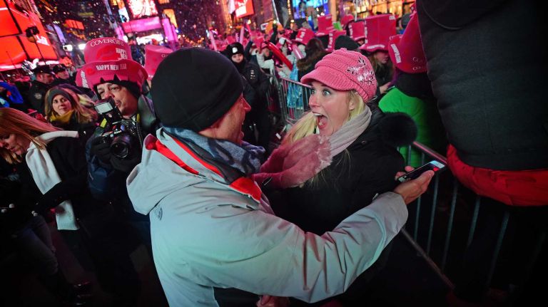 Dennis Brown and Sheridan Nichols of Tennessee share a kiss in Times Square as they ring in the New Year on January 1, 2015
