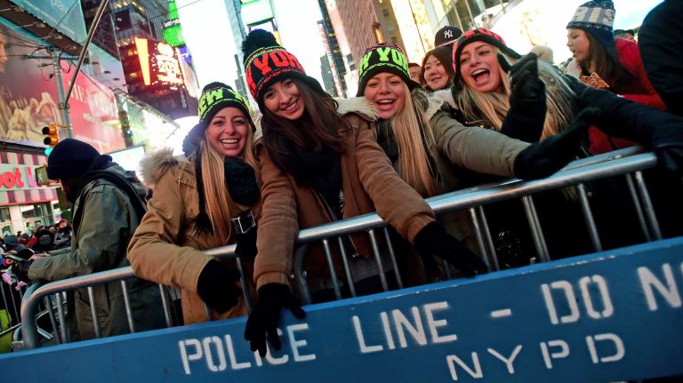 Lindsay Wells, Brianna Windover, Stacy Wells and Daphne Wells, of Los Angeles, celebrate New Year's Eve in Times Square on Dec. 31, 2014.