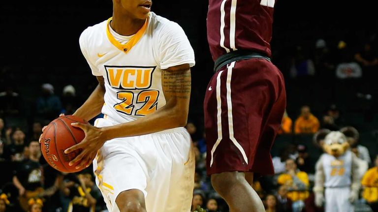 NEW YORK, NY - MARCH 12: Jon Severe #10 of the Fordham Rams defends against Melvin Johnson #32 of the Virginia Commonwealth Rams during the Second Round of the Atlantic 10 Basketball Tournament at Barclays Center on March 12, 2015 in New York, New York. (Photo by Mike Stobe/Getty Images)