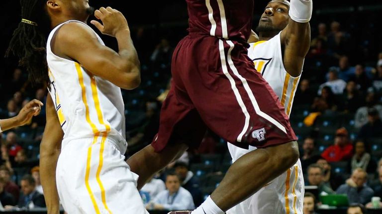 NEW YORK, NY - MARCH 12: Jon Severe #10 of the Fordham Rams goes up for a shot against the Virginia Commonwealth Rams during the Second Round of the Atlantic 10 Basketball Tournament at Barclays Center on March 12, 2015 in New York, New York. (Photo by Mike Stobe/Getty Images)