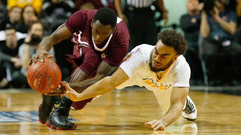 NEW YORK, NY - MARCH 12: Jonathan Williams #10 of the Virginia Commonwealth Rams and Antwoine Anderson #0 of the Fordham Rams battle for the loose ball during the Second Round of the Atlantic 10 Basketball Tournament at Barclays Center on March 12, 2015 in the Brooklyn borough of New York City. (Photo by Mike Stobe/Getty Images)