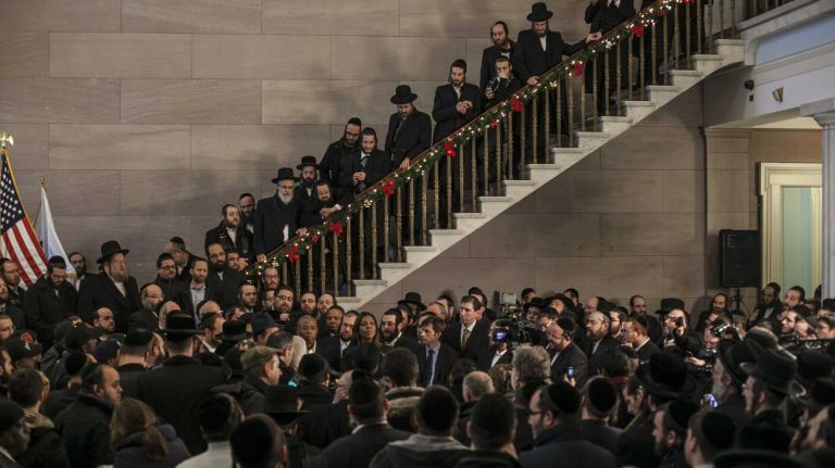 Members of the Hasidic community gather at a Jan. 5, 2014 news conference decrying a New York Post story that painted slaying victim Menachem Stark as a slumlord. Stark's body was found in a Great Neck trash bin after he was abducted in Williamsburg, Brooklyn.