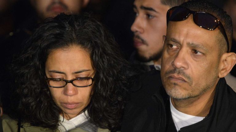 Lucy Ramos, aunt of slain NYPD Officer Rafael Ramos, gathers with family and friends during a news conference outside their home in Brooklyn on Sunday, Dec. 21, 2014.