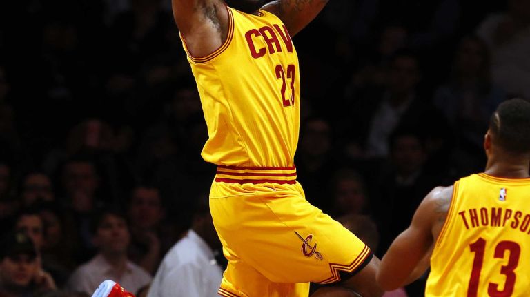 LeBron James #23 of the Cleveland Cavaliers looks to pass the ball in the first quarter against the Brooklyn Nets at Barclays Center on Monday, Dec. 8, 2014.