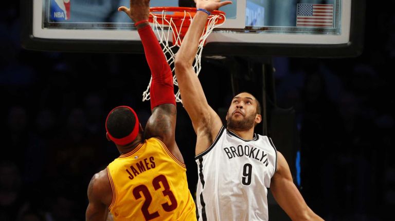 LeBron James #23 of the Cleveland Cavaliers puts up a shot in the first quarter against Jerome Jordan #9 of the Brooklyn Nets at Barclays Center on Monday, Dec. 8, 2014.