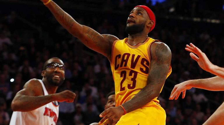LeBron James of the Cleveland Cavaliers goes for a layup against the New York Knicks at Madison Square Garden on Thursday, Dec. 4, 2014.