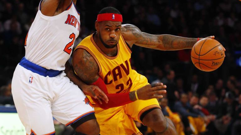 LeBron James of the Cleveland Cavaliers drives to the hoop against Iman Shumpert of the New York Knicks in the second half at Madison Square Garden on Thursday, Dec. 4, 2014.